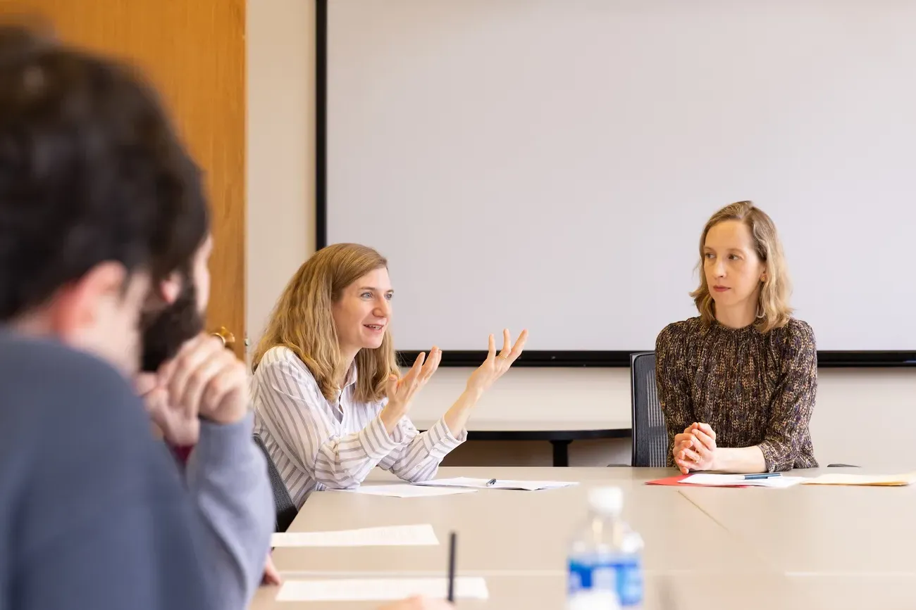 People talking at a table.