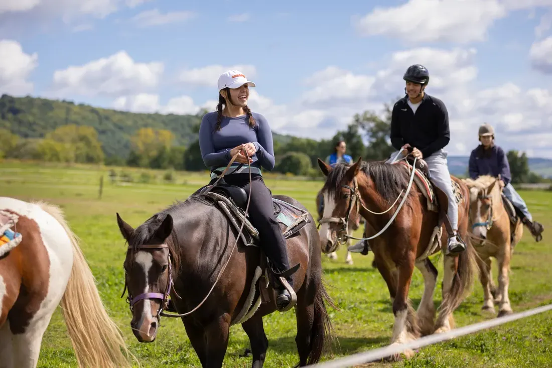 Students horseback riding.